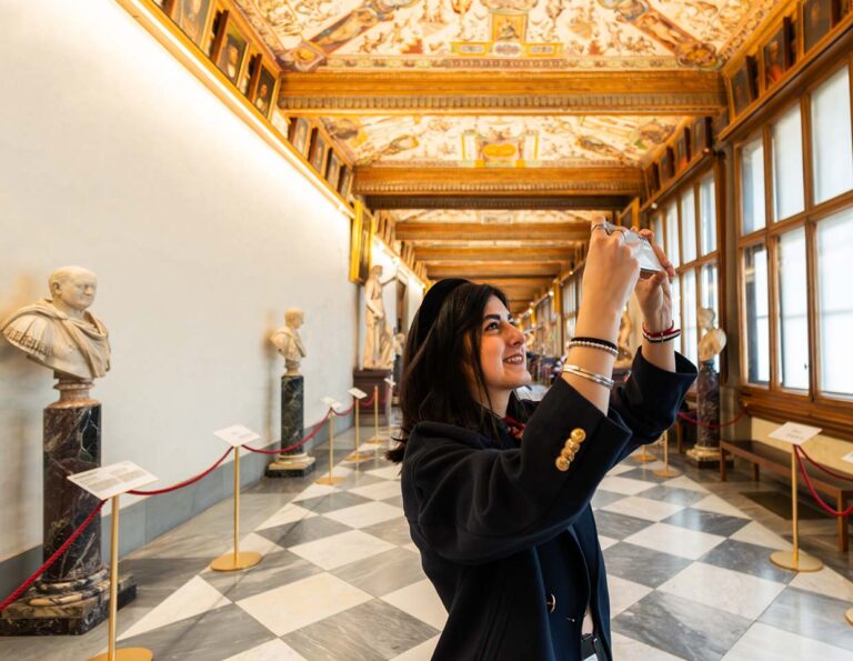 Marble statue stands prominently in the Uffizi Gallery